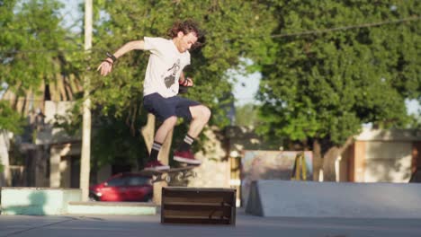 A-redhead-man-jumps-off-a-quarter-pipe-ramp-on-his-skateboard