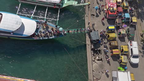Aerial-top-down-of-people-offloading-from-an-island-hopping-commuter-boat