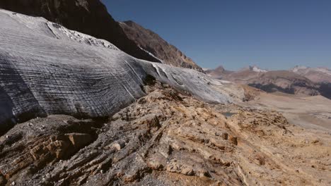 Glacier-in-mountains-circling-aerial