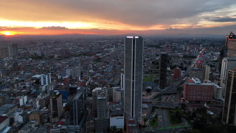 Aerial-view-around-the-Torre-Colpatria-tower,-sunny-evening-in-Bogota,-Colombia