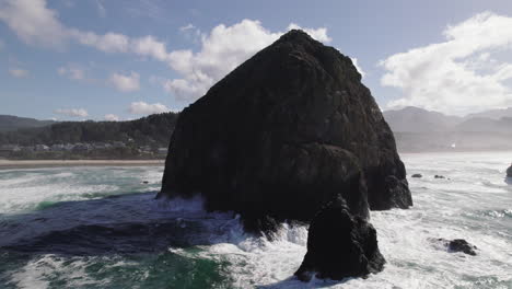 Foamy-seawater-crashes-against-Haystack-Rock-in-Oregon
