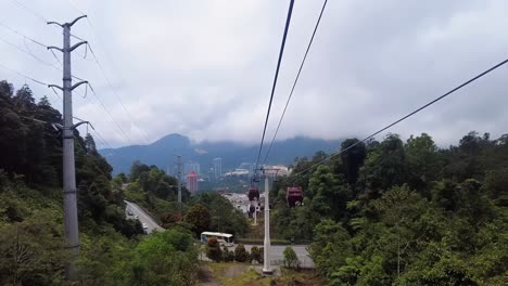 Descending-cable-car-passenger's-view-of-ascending-carriages-at-Resorts-World,-Genting-Highlands,-a-premier-tourism-destination-in-Malaysia