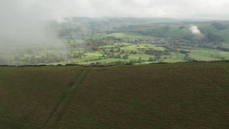 Cinematic-reveal-of-cloudy-valley-in-Peak-District-National-Park