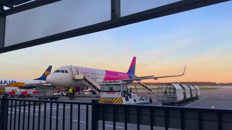 Wizzair-airplane-and-ground-infrastructure-material-waiting-for-departure