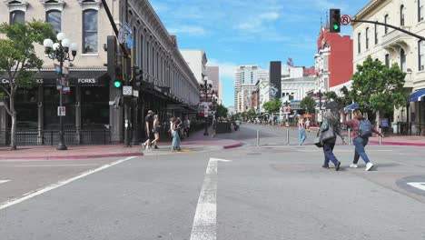 People-enjoying-a-walk-in-Downtown-district-Gaslamp-In-San-Diego,-restored-historical-centre