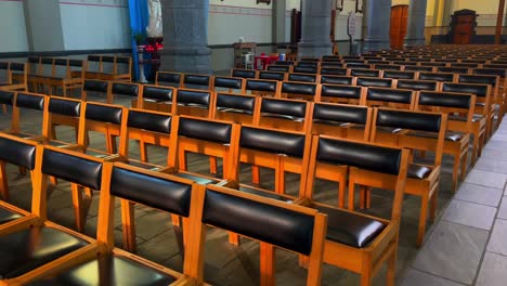 Row-of-chairs-for-audience-and-churchgoer-and-worshipper-in-Catholic-Belgian-church