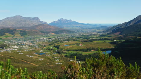 Slider-view-over-lush-Franschhoek-valley-landscape-surrounded-by-mountains