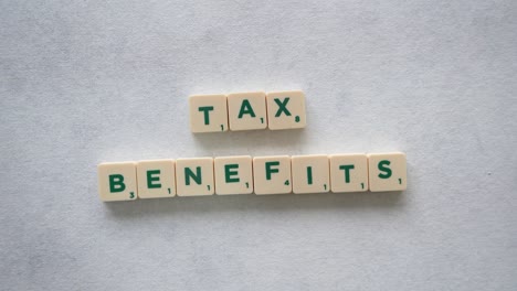 Phrase-"Tax-Benefits"-with-green-letters