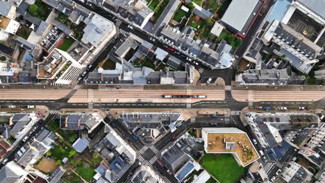aerial-top-shot-over-Le-Mans-tramway--crossing-the-city-France