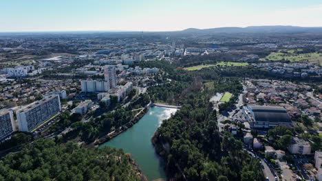Aerial:-La-Mosson's-dam-stands-tall-amid-urban-evolution.