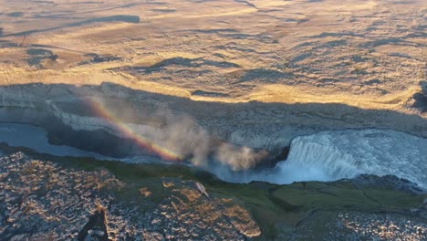 Aerial-drone-shot-of-Dettifoss,-rainbow-sunset-time