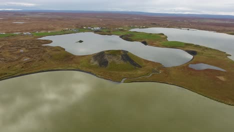 Aerial-drone-shot-flying-over-Myvatn-lake-in-Iceland,-medium-flight-altitude.