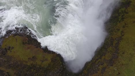 Aerial-drone-shot-flying-Gulfoss-waterfall-in-Iceland.-Cloudy-day;-low-altitude