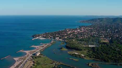 Ponds-villepey-in-front-of-the-mediterranean-sea-Saint-aygulf-city-aerial-France