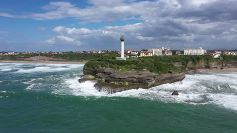 Flying-around-Biarritz-white-lighthouse-sunny-day-Basque-Country