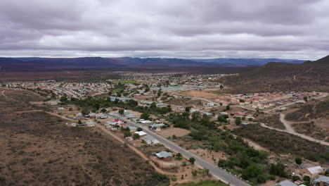 South-Africa-city-surrounded-by-mountains-aerial-hot-cloudy-day