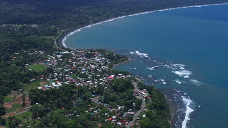 Aerial-panorama-of-Puerto-Viejo,-Costa-Rica,-showcasing-its-vibrant-coastal
