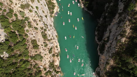 Top-aerial-shot-over-the-river-canyon-Verdon-gorges-full-of-kayaks-and-pedalo