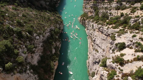 Verdon-Gorge-river-canyon-crowded-summer-day-aerial-tourist-on-kayak-and-leisure