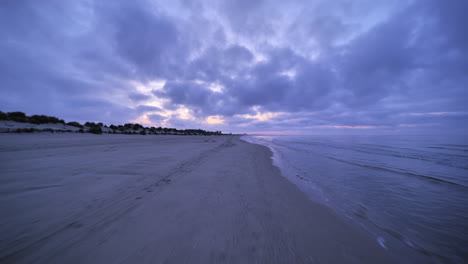 Cycling-on-a-beach-first-person-view-between-Carnon-and-la-Grande-Motte-sunrise