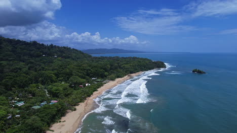 Aerial-view-of-a-pristine-coastline-embraced-by-lush-jungle-in-Puerto-Viejo.
