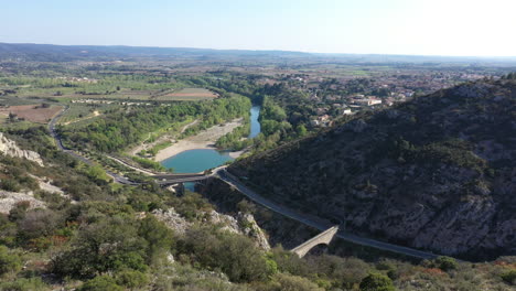 Discovering-herault-river-with-bridges-pont-du-diable-aerial-view-sunny-day