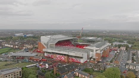 A-panoramic-aerial-perspective-capturing-the-essence-of-Anfield,-with-distant-fa