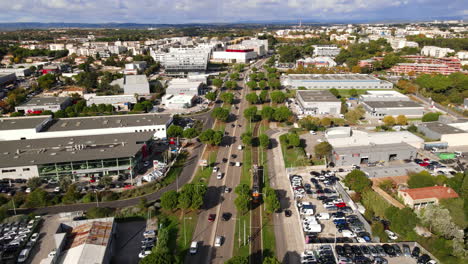 Aerial-Montpellier-view:-modern-apartments,-busy-roads,-and-commercial-zones.