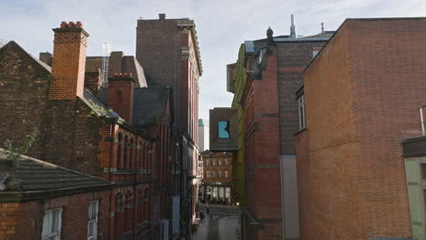 Aerial-glide-over-Liverpool's-narrow-streets,-revealing-urban-charm.