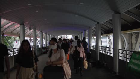 Everyday-Commuters-Walking-Through-The-Busy-Sky-Walk-Of-Siam-Train-Station-In-Bangkok-Thailand