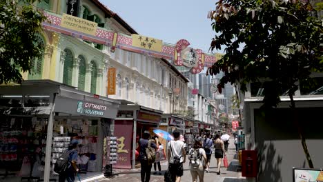 Tourists-Walking-Along-Pagoda-Street-On-Sunny-Afternoon-In-Chinatown,-Singapore