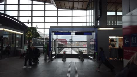 People-Walk-Inside-Basel-SBB-Railway-Station,-Switzerland-Terminal-Architecture