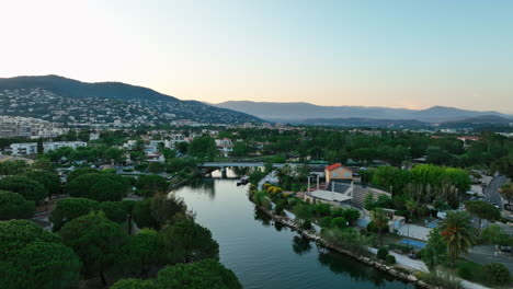 Aerial-Serenity:-La-Siagne-River-with-Mandelieu-Backdrop