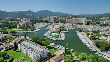 A-high-angle-view-showcases-the-elegance-of-Mandelieu-la-Napoule's-marina,-a-hav