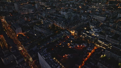 A-breathtaking-aerial-view-of-Paris's-13th-arrondissement,-with-illuminated-high