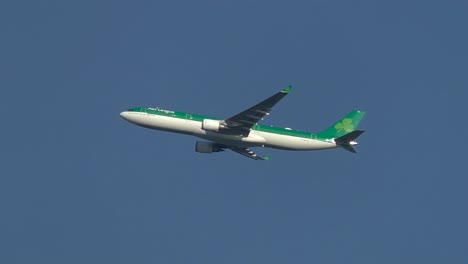tracking-shot-of-Aer-Lingus-Airlines-flying-in-the-sky-during-takeoff