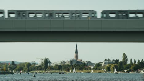 Railway-or-metro-passing-over-railway-bridge-in-Vienna-Alte-Donau