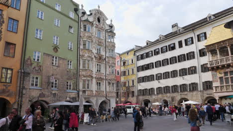 People-passing-by-square-in-Innsbruck-downtown,-Austria