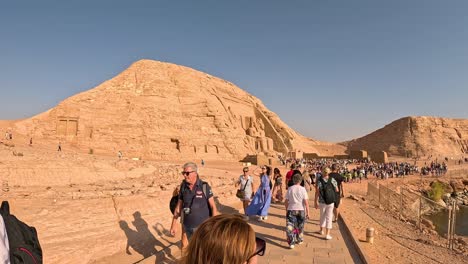 High-angle-wide-view-of-tourists-roaming-around-iconic-pathway-leading-to-beautiful-wonder-of-the-human-world