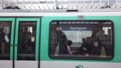 Paris-Metro-Shot-Train-Leaving-Stalingard-Station-Outdoors,-France-Closeup-Shot
