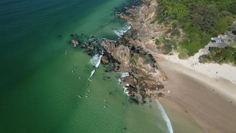 Tourists-At-Clarkes-Beach-In-NSW,-Australia---aerial-drone-shot