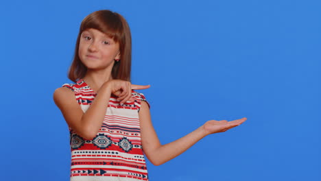 School-girl-showing-thumbs-up-and-pointing-empty-right-place,-advertising-area-for-commercial-logo
