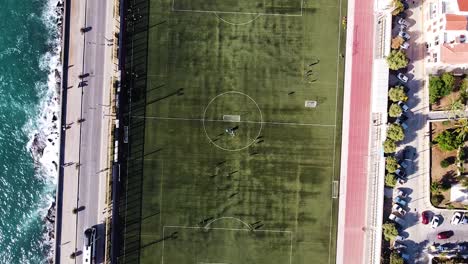 Coastal-football-field-of-Rethymno,-aerial-top-down-view