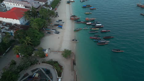 Flying-over-stone-town-beach-in-Tanzania-with-fisher-and-tourist-boats