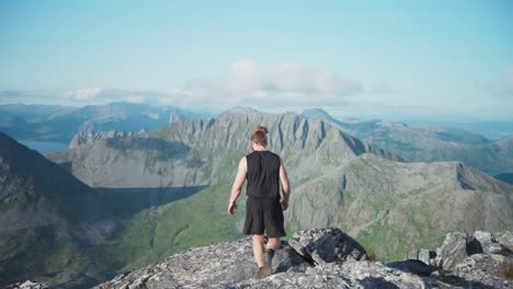 Caucasian-Hiker-On-The-Mountain-Peak-In-Lonketinden,-Norway