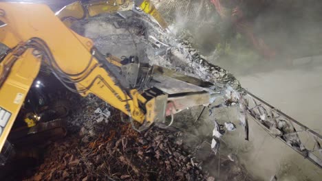 Multiple-Hydraulic-machines-working-together-to-safely-demolish-a-steel-bridge