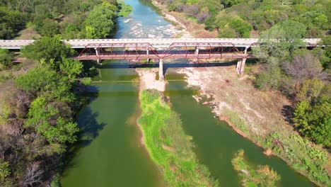 Aerial-flight-over-the-Brazos-River-and-flying-over-the-Old-Brazos-Point-Bridge-in-Texas