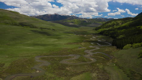 High-Aerial-of-Winding-East-River-East-of-Crested-Butte-Mountain-with-Double-Top-North-and-South-in-Background---Spring