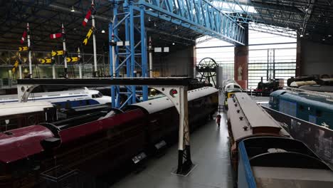 panning-shot-of-the-vast-collection-of-trains-at-The-National-Railway-Museum-In-York