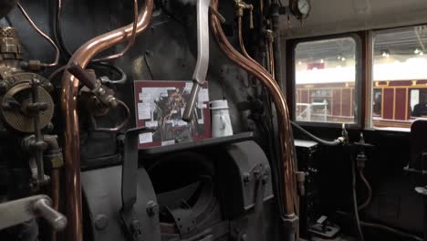 tilting-shot-within-a-steam-train-cab-in-The-National-Railway-Museum-In-York